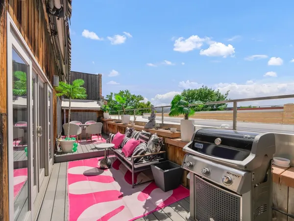 a room with furniture and a flat screen tv