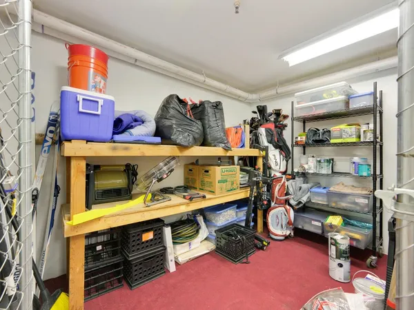 a room with lots of white furniture and decor