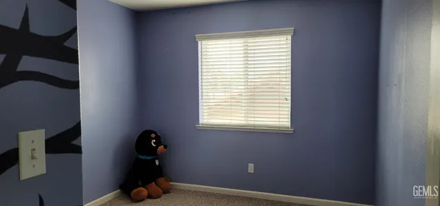 a room with a window and flowerpot