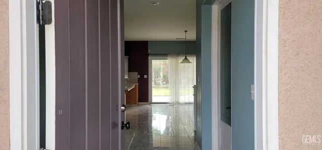 a view of a bathroom from a hallway