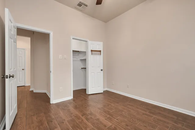 a view of a livingroom with wooden floor