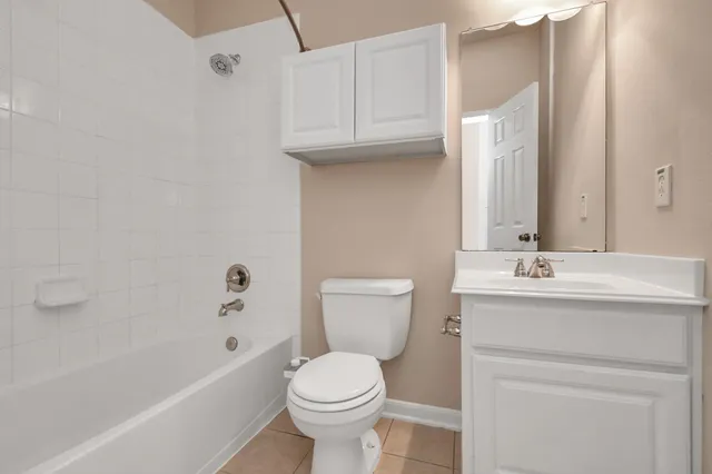 a bathroom with a sink a toilet and bathtub