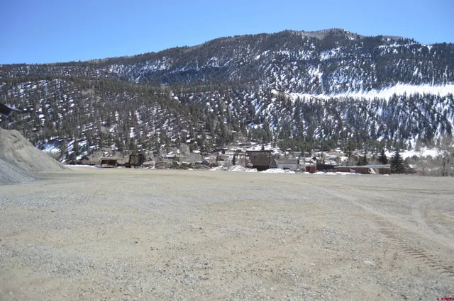 a view of a town with mountains in the background