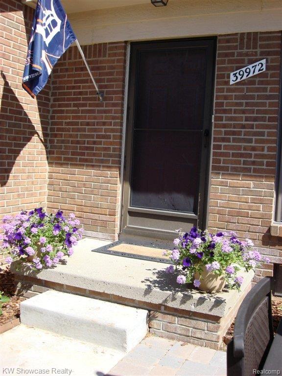 39972 Crosswinds Road Novi, MI 48375 - Photo 1 of 24 Privated Gated Paver Courtyard