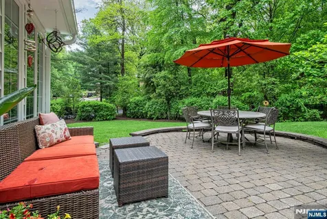 a view of a sitting area with furniture and backyard