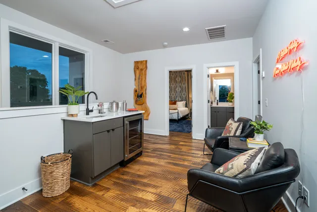 a living room with furniture and a potted plant
