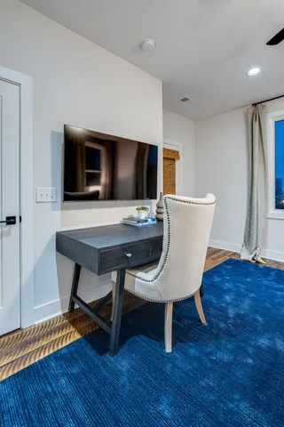 a workspace with furniture and wooden floor