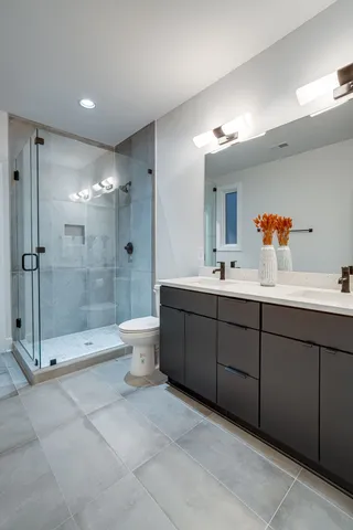 a bathroom with a shower and a toilet