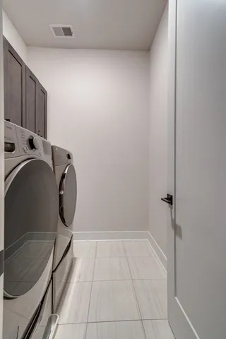 a view of a hallway with wooden floor and furniture