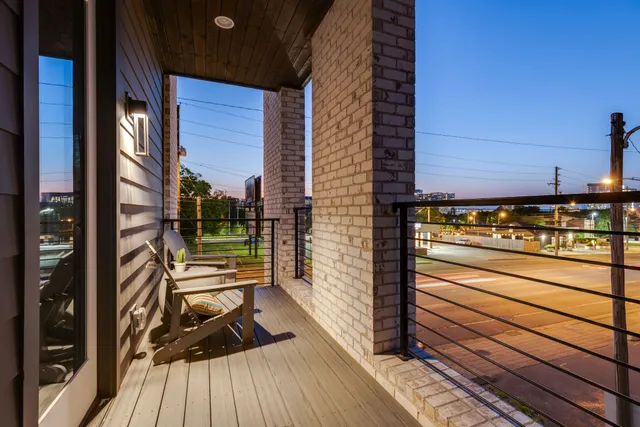 a view of a patio with table and chairs