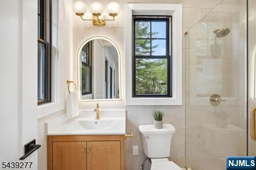 12 Locust Place Livingston, NJ 07039 - Photo 9 of 17 a bathroom with a sink a mirror and a window