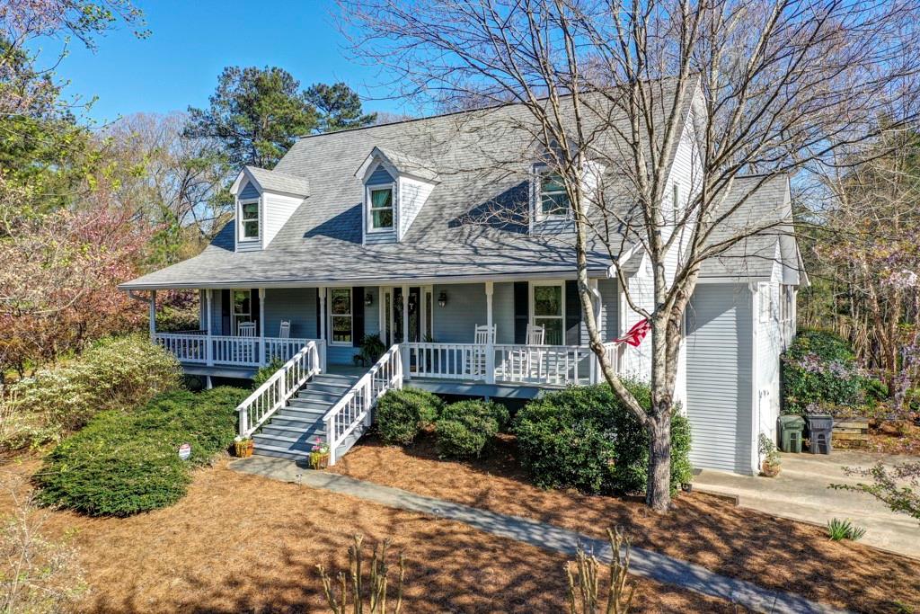 299 Fontaine Road Southwest Mableton, GA 30126 - Photo 1 of 1 a front view of a house with garden