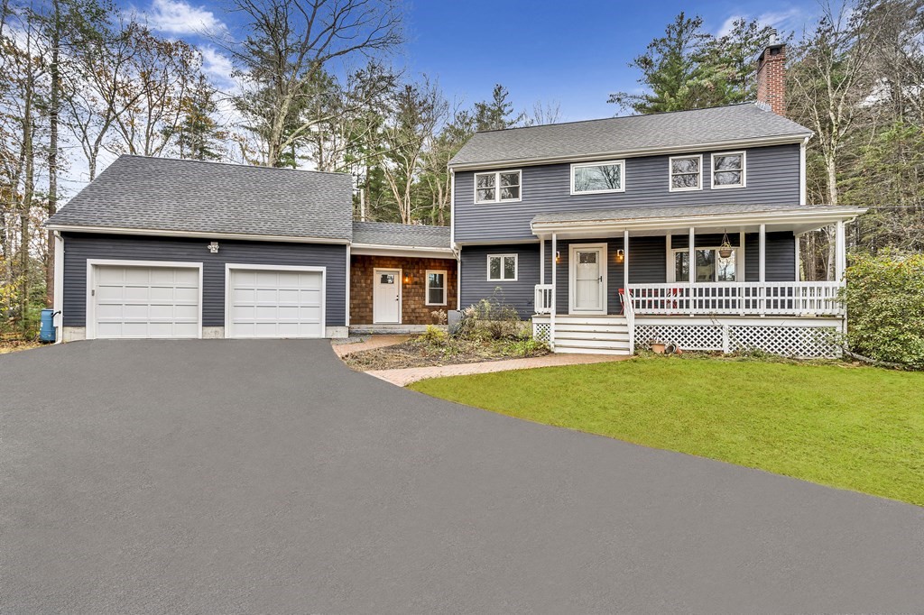 222 Middle Road Boxborough, MA 01719 - Photo 1 of 15 front view of a house with a yard