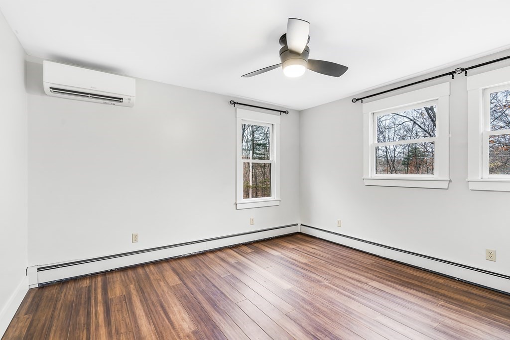222 Middle Road Boxborough, MA 01719 - Photo 11 of 15 a view of empty room with wooden floor and fan