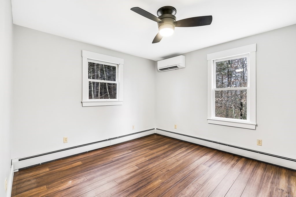 222 Middle Road Boxborough, MA 01719 - Photo 12 of 15 wooden floor in an empty room with a window