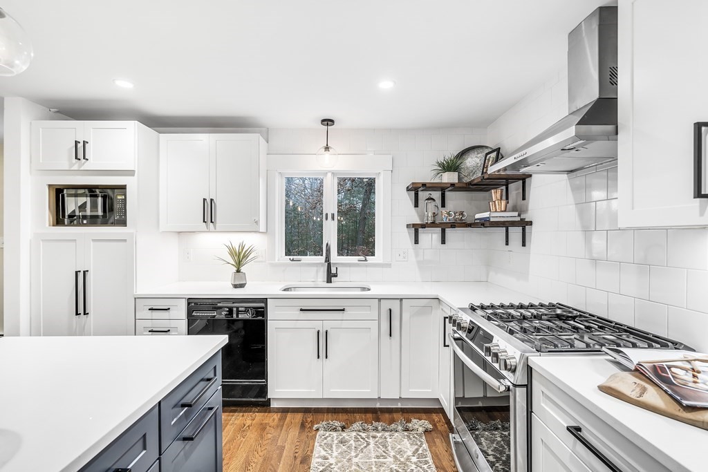 222 Middle Road Boxborough, MA 01719 - Photo 4 of 15 a kitchen with a stove sink and cabinets
