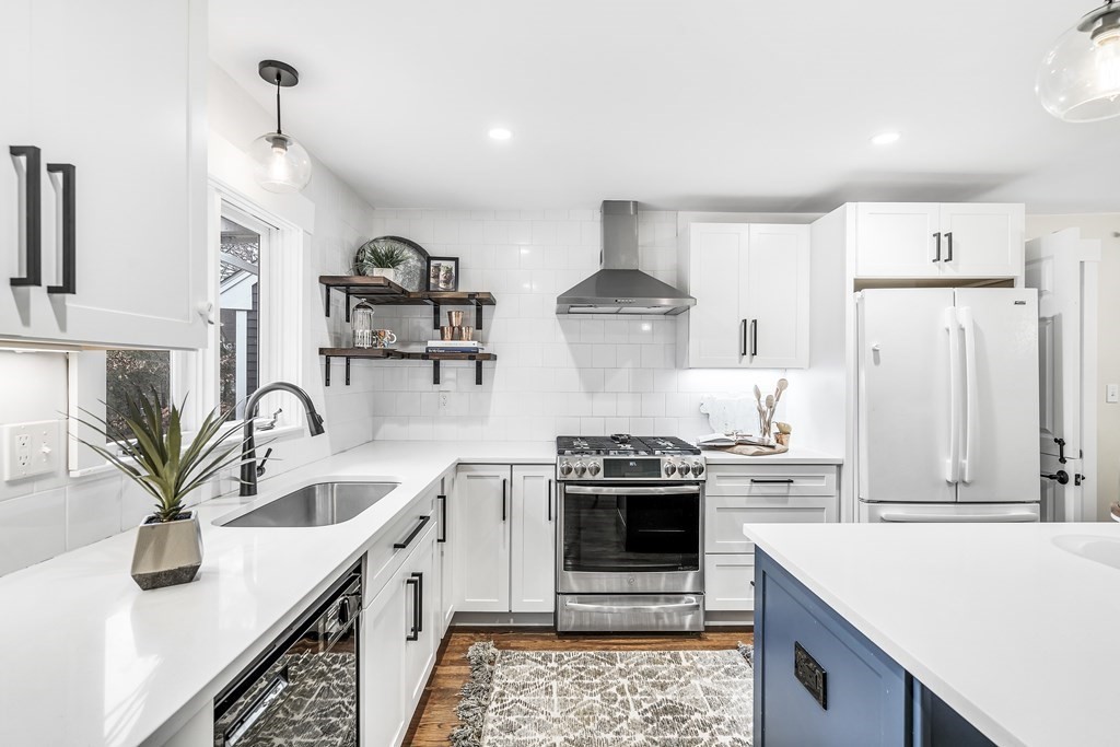 222 Middle Road Boxborough, MA 01719 - Photo 5 of 15 a kitchen with stainless steel appliances granite countertop a sink a stove and a refrigerator