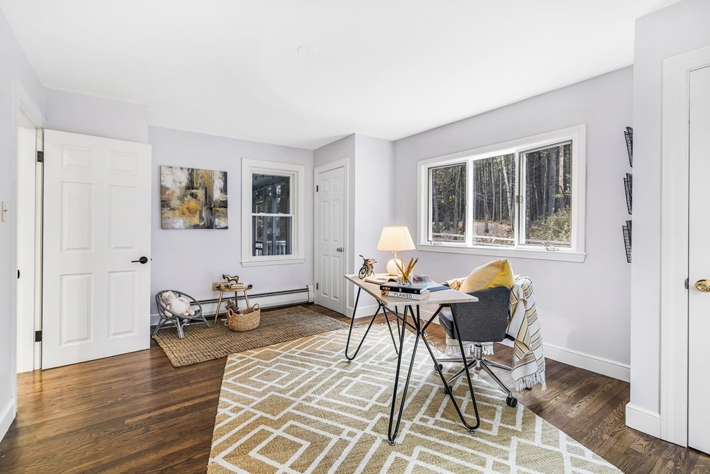 222 Middle Road Boxborough, MA 01719 - Photo 8 of 15 a workspace with wooden floor and a rug