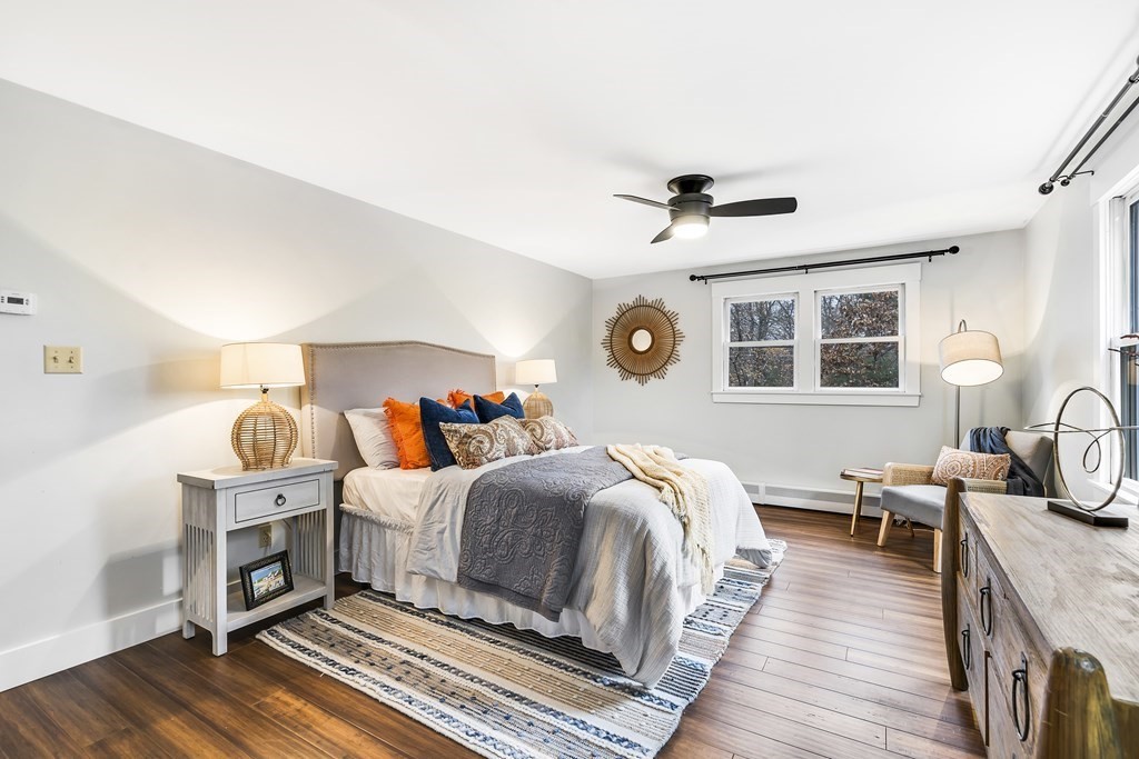 222 Middle Road Boxborough, MA 01719 - Photo 10 of 15 a room with bed a fireplace and a window