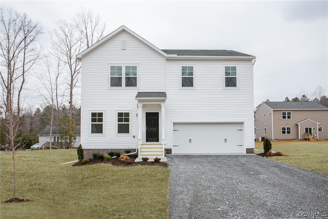 67 Chelsea Circle Aylett, VA 23009 - Photo 2 of 36 a view of a house with backyard
