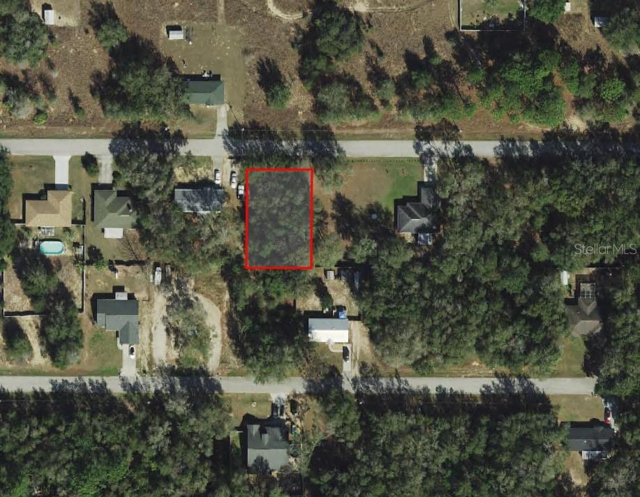 3970 East Scotty Street Inverness, FL 34453 - Photo 1 of 4 an aerial view of residential house with outdoor space and lake view