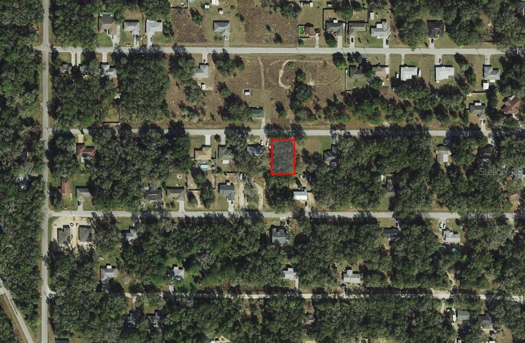 3970 East Scotty Street Inverness, FL 34453 - Photo 2 of 4 an aerial view of residential houses with outdoor space and trees