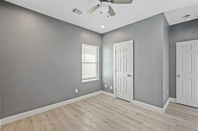 a bathroom with a toilet a sink and a window