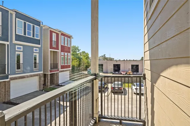 a kitchen with kitchen island granite countertop a sink cabinets and stainless steel appliances