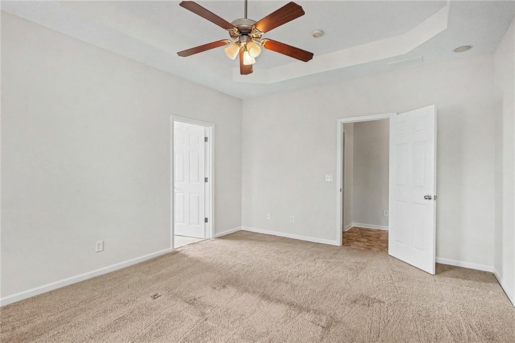 1558 Kilgore Road Griffin, GA 30223 - Photo 17 of 32 an empty room with closet and a ceiling fan