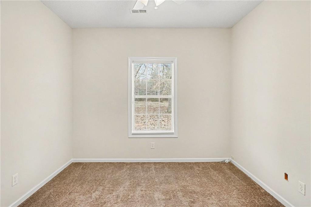 1558 Kilgore Road Griffin, GA 30223 - Photo 19 of 32 an empty room with a window