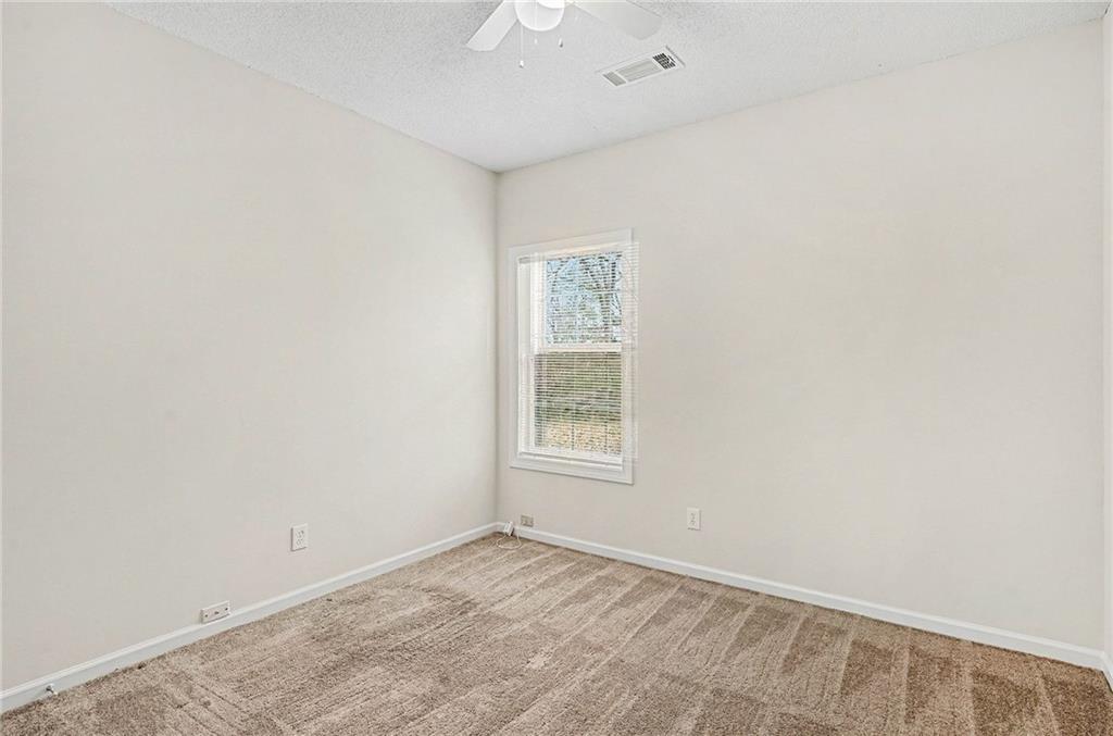 1558 Kilgore Road Griffin, GA 30223 - Photo 22 of 32 an empty room with a window