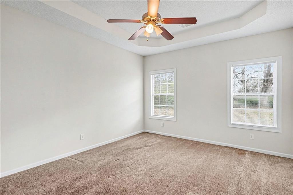 1558 Kilgore Road Griffin, GA 30223 - Photo 24 of 32 an empty room with a window and a fan