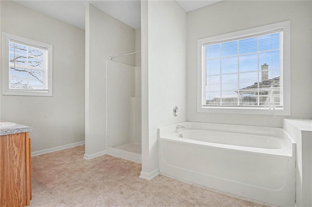 1558 Kilgore Road Griffin, GA 30223 - Photo 25 of 32 a white bath tub sitting next to a window