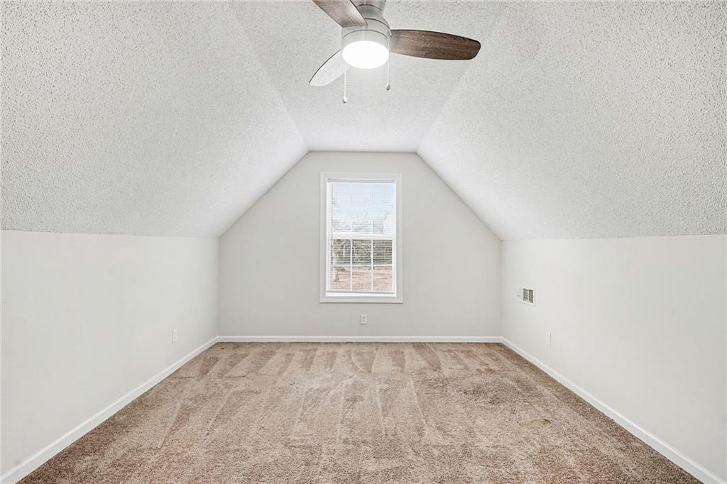 1558 Kilgore Road Griffin, GA 30223 - Photo 26 of 32 an empty room with a window and a fan