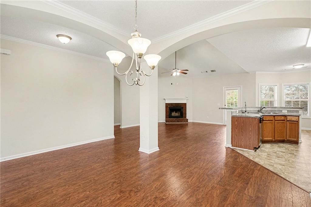 1558 Kilgore Road Griffin, GA 30223 - Photo 4 of 32 a view of a kitchen with a sink and wooden floor
