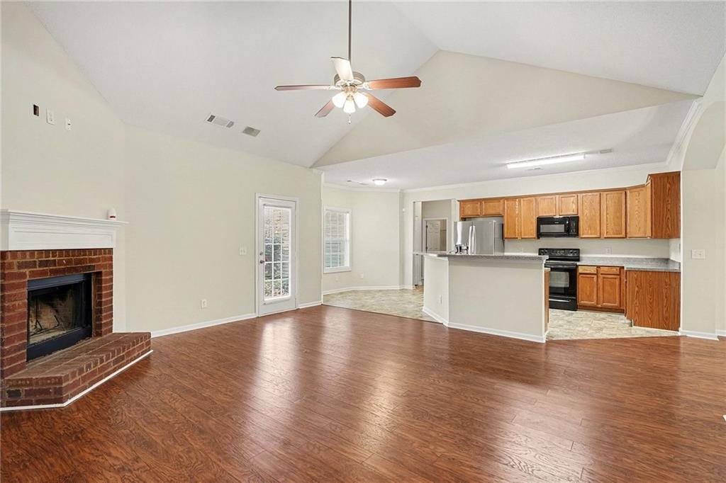 1558 Kilgore Road Griffin, GA 30223 - Photo 8 of 32 a view of a kitchen with a sink cabinets and wooden floor