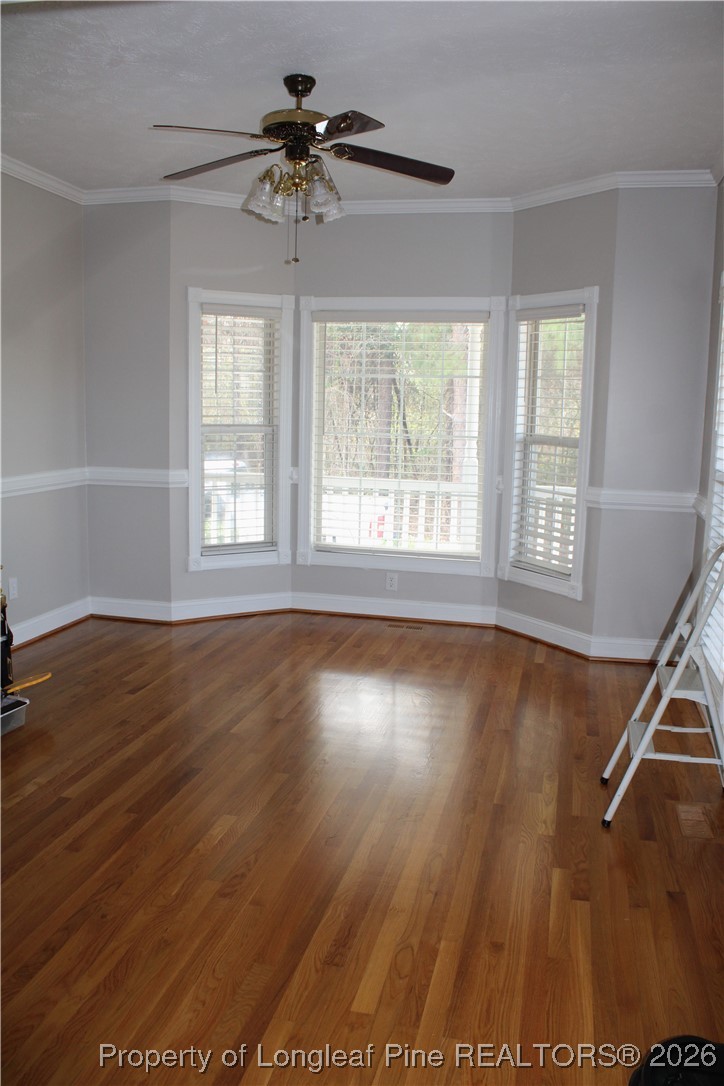 573 Porter Road Hope Mills, NC 28348 - Photo 4 of 29 a view of an empty room with wooden floor and a window