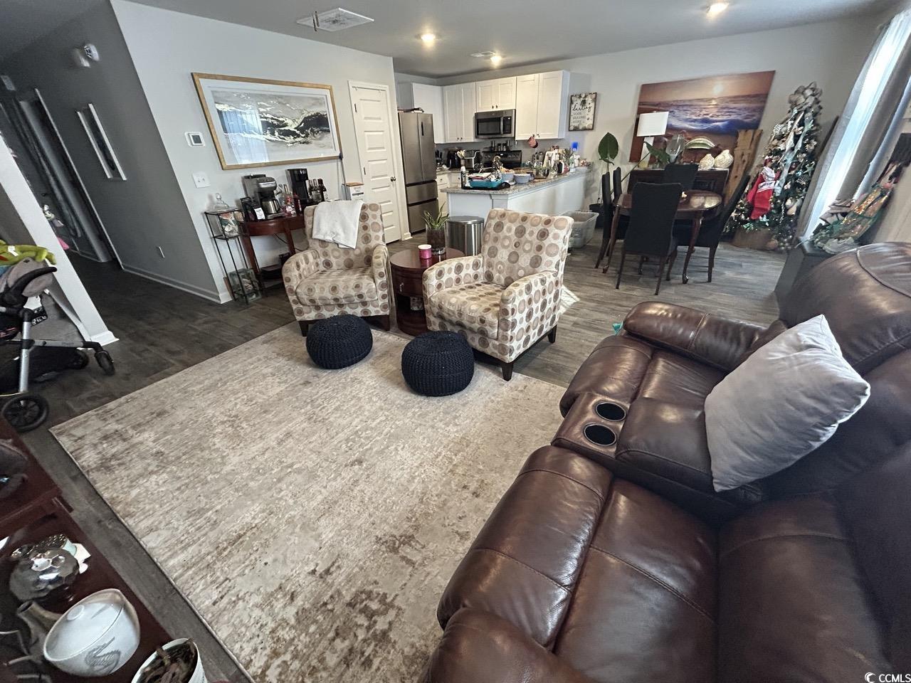 463 Ribbon Rail Way Loris, SC 29569 - Photo 18 of 27 Living area with wood finished floors and baseboards