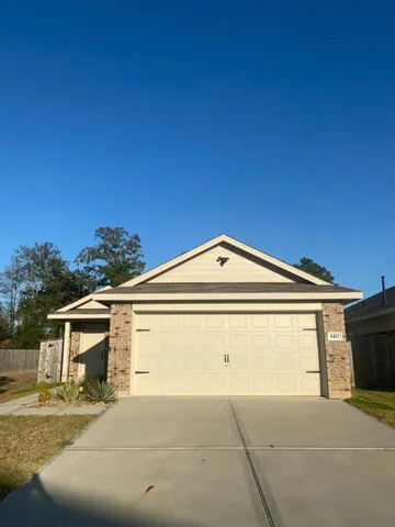a front view of a house with a garage