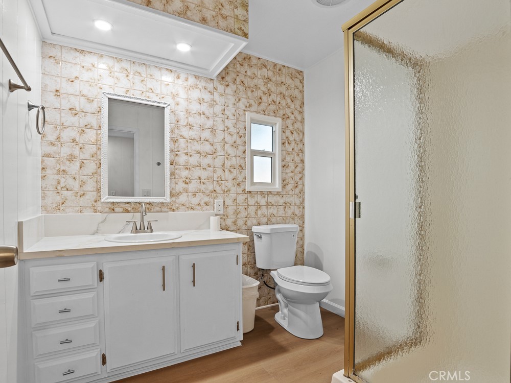 8301 Mission Gorge Road, Unit 172 Santee, CA 92071 - Photo 16 of 30 a spacious bathroom with a toilet sink and mirror