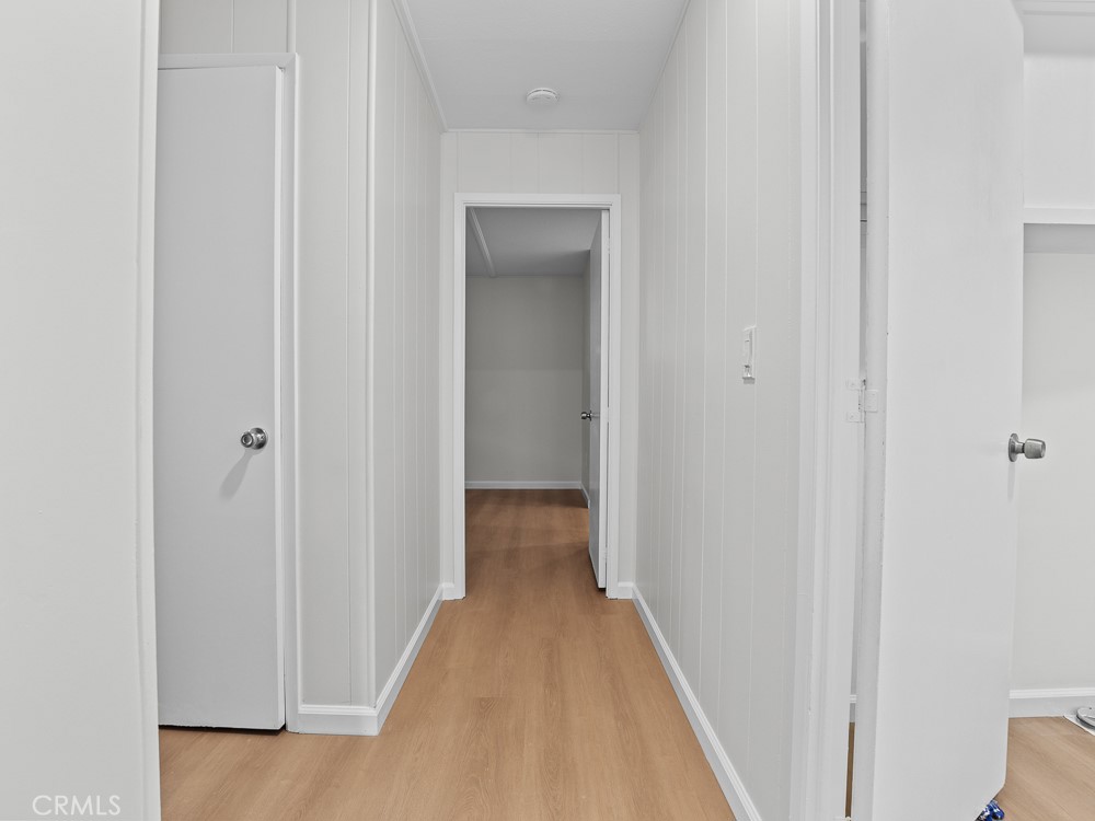 8301 Mission Gorge Road, Unit 172 Santee, CA 92071 - Photo 17 of 30 a view of a hallway with a wooden floor