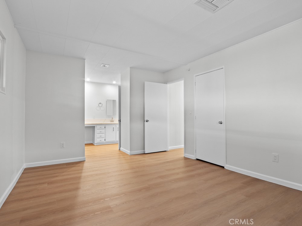 8301 Mission Gorge Road, Unit 172 Santee, CA 92071 - Photo 19 of 30 a view of an empty room with wooden floor
