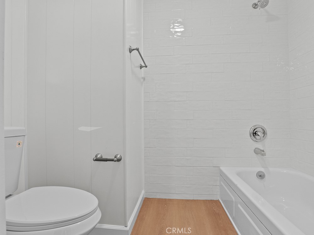 8301 Mission Gorge Road, Unit 172 Santee, CA 92071 - Photo 21 of 30 a bathroom with a toilet and a tub