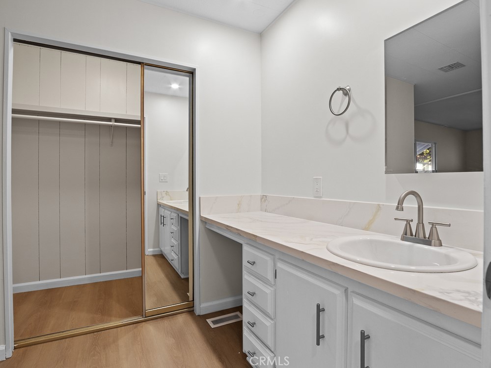 8301 Mission Gorge Road, Unit 172 Santee, CA 92071 - Photo 22 of 30 a bathroom with a sink and a mirror