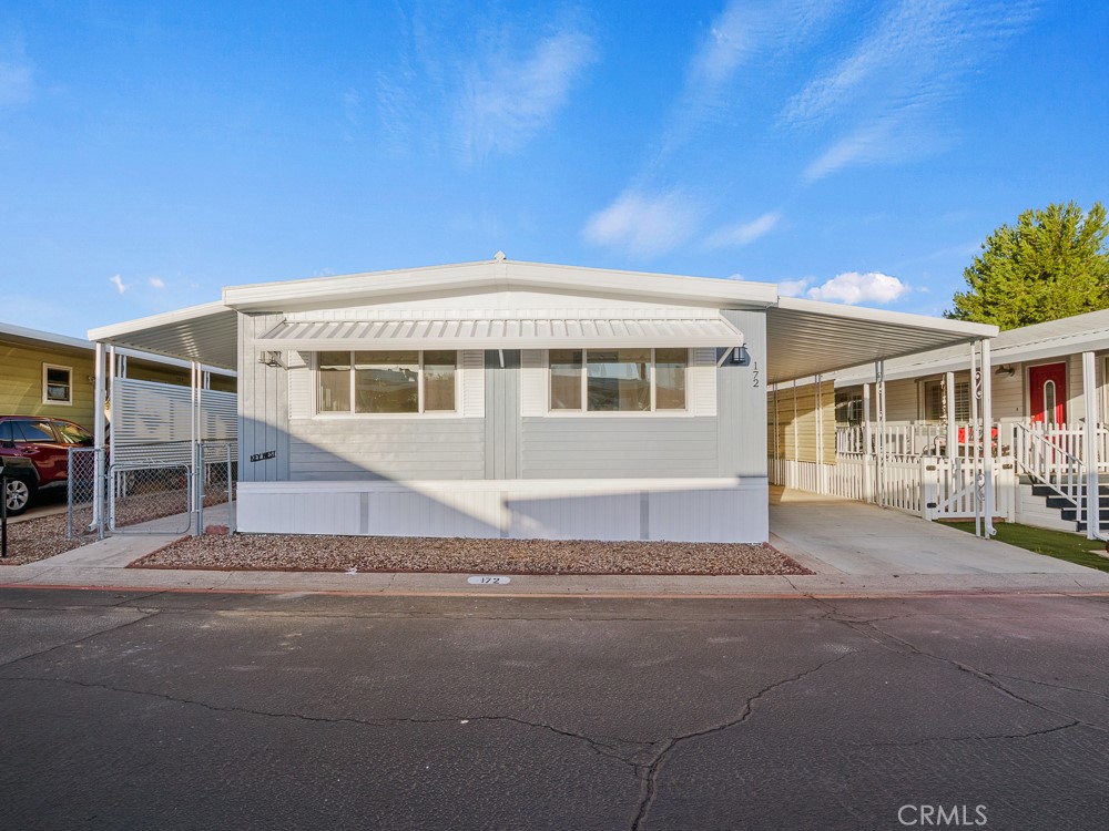 8301 Mission Gorge Road, Unit 172 Santee, CA 92071 - Photo 23 of 30 a front view of a house with a garden