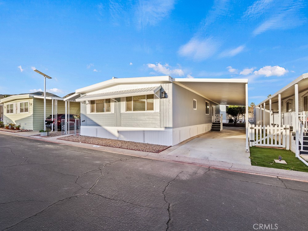 8301 Mission Gorge Road, Unit 172 Santee, CA 92071 - Photo 24 of 30 a front view of a house with a yard