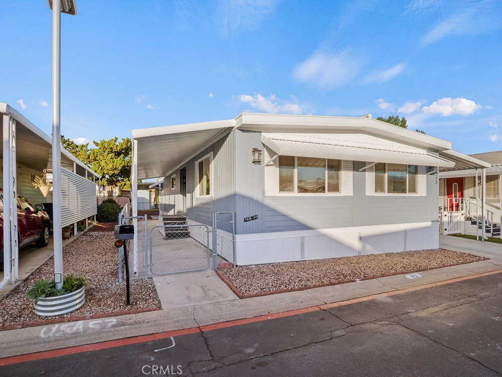 8301 Mission Gorge Road, Unit 172 Santee, CA 92071 - Photo 25 of 30 a front view of a house with garden and plants
