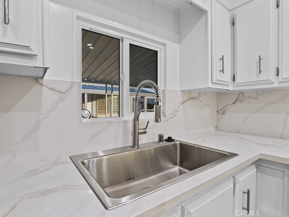 8301 Mission Gorge Road, Unit 172 Santee, CA 92071 - Photo 4 of 30 a kitchen with a sink and cabinets