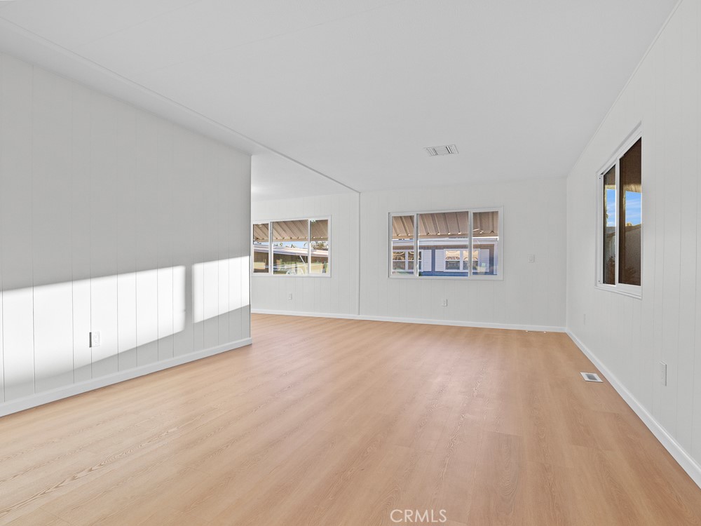 8301 Mission Gorge Road, Unit 172 Santee, CA 92071 - Photo 7 of 30 a view of an empty room with a window and wooden floor