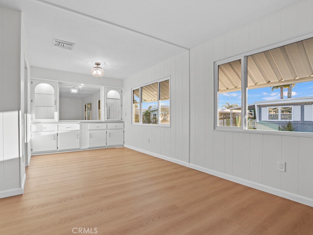 8301 Mission Gorge Road, Unit 172 Santee, CA 92071 - Photo 9 of 30 a view of an empty room with kitchen view and a window